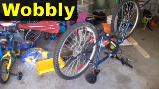 How To Straighten A Wobbly Bicycle WheelTutorial [upl. by Hanahs962]