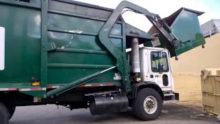 Garbage truck emptying a dumpster [upl. by Thora]