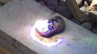 Solar heat ray lens from TV melts rock into lava then glass [upl. by Hedgcock267]