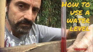 How to use a water level  the diy basics [upl. by Ruomyes]